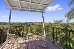 Looking out to plants and sea from the deck